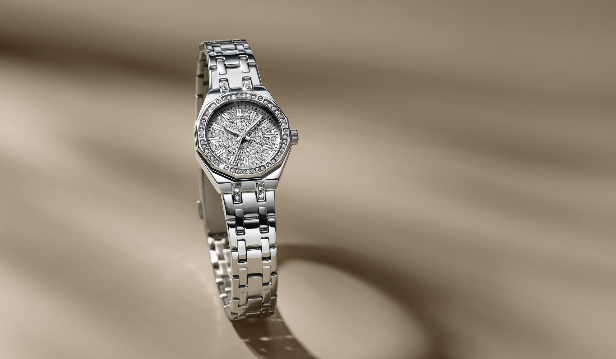 Silver watch with a detailed face on a beige background GW0931L1