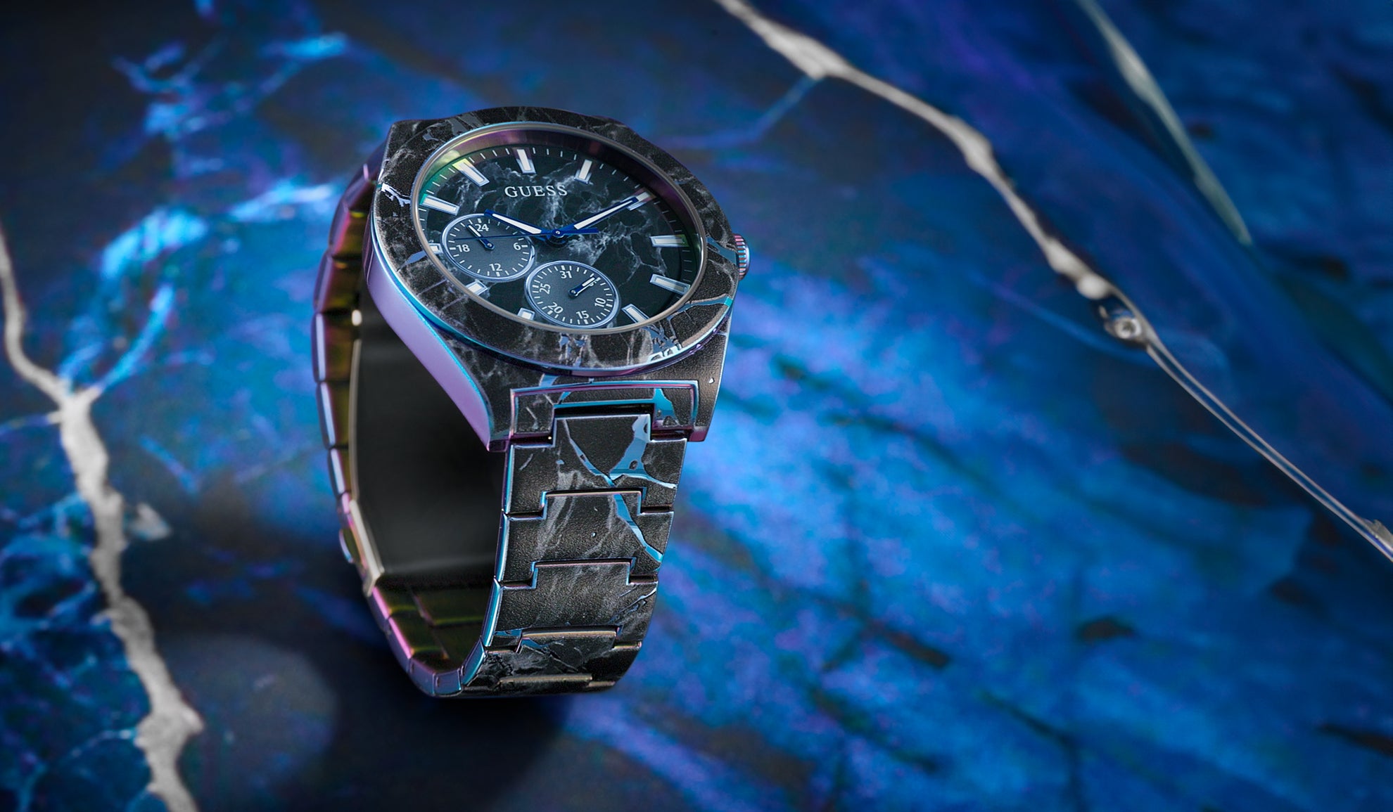 GUESS Mens watch on a blue textured background GW0953G2