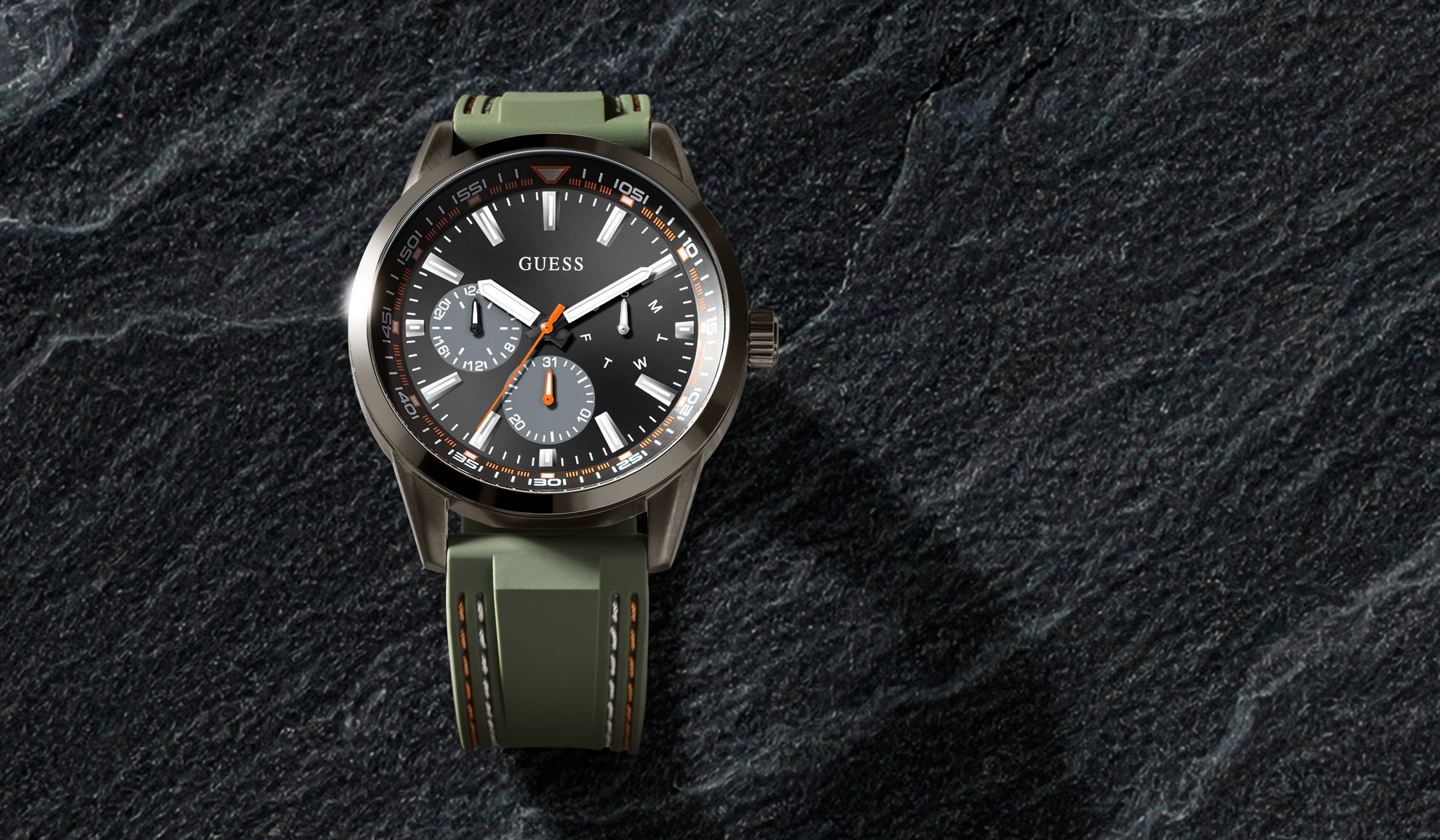 mens green sport watch on stone background