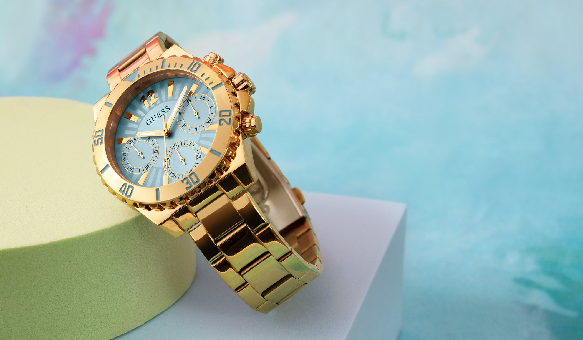 gold watch with light blue dial