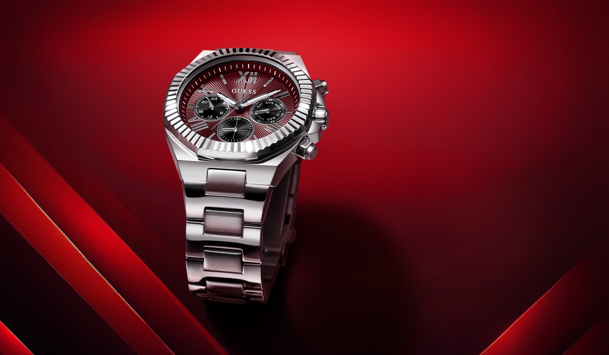 Silver watch with a red face on a red background gw0703g7