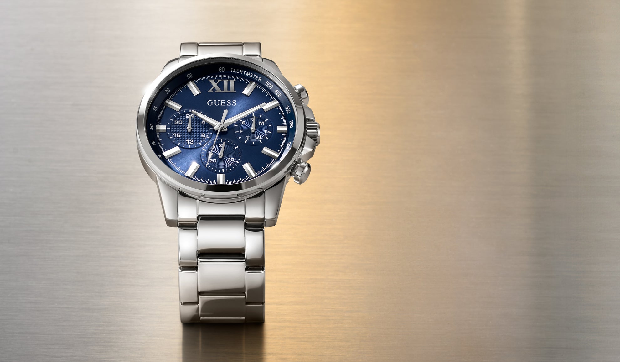 Silver watch GW0900G4 with blue face on a metallic background