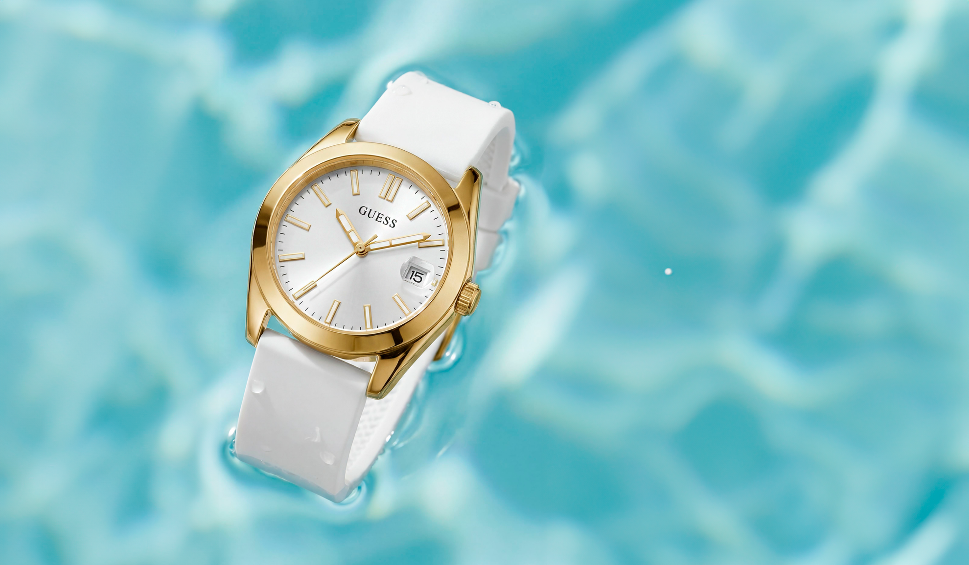 Gold and white watch with a water background
