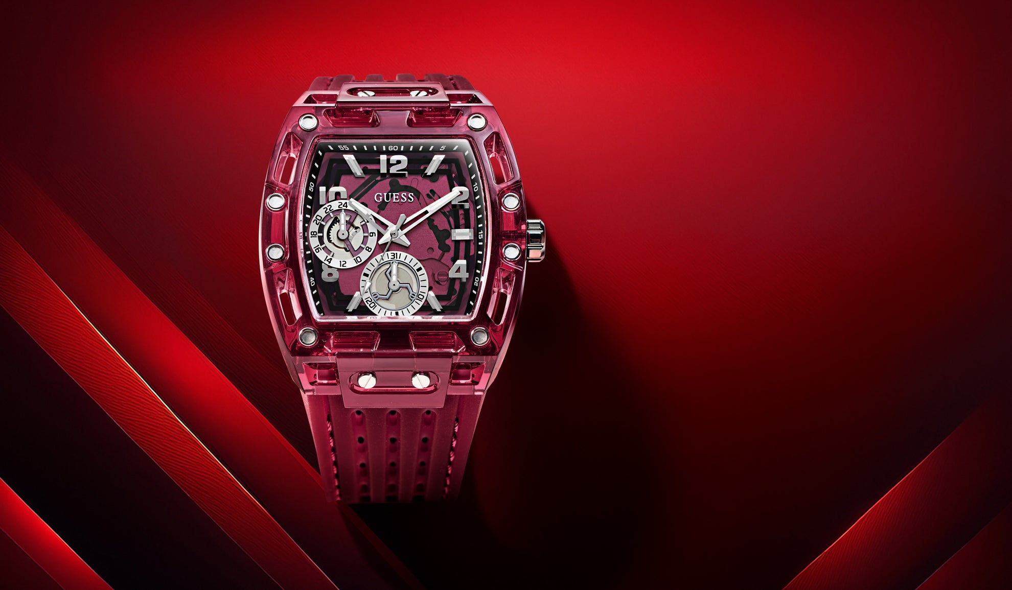 Red Guess watch with intricate design on a red background gw0499g12