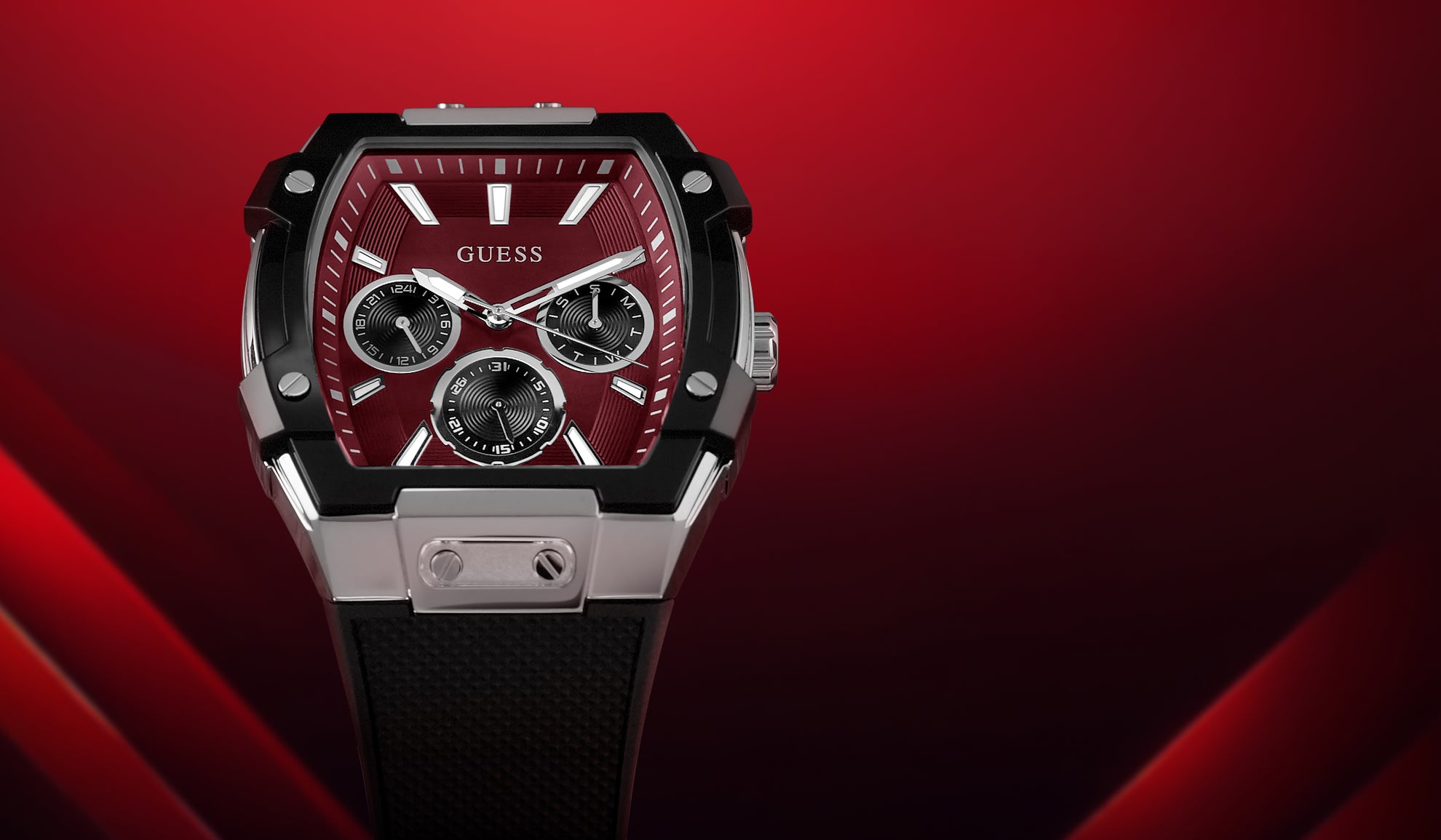 GUESS watch with red face and black strap on a red background gw0956g1