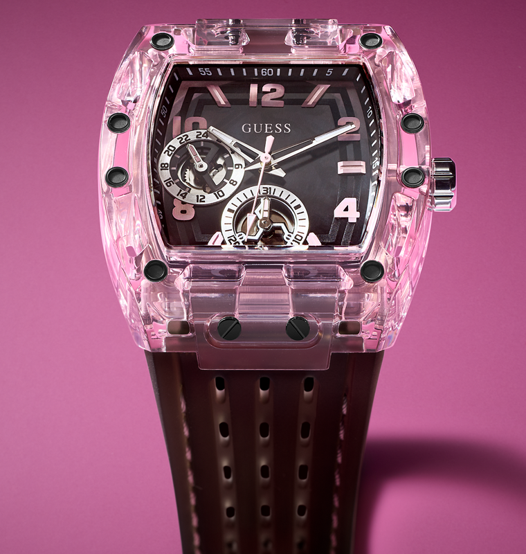 Pink transparent Sporting Pink watch with black strap on a pink background