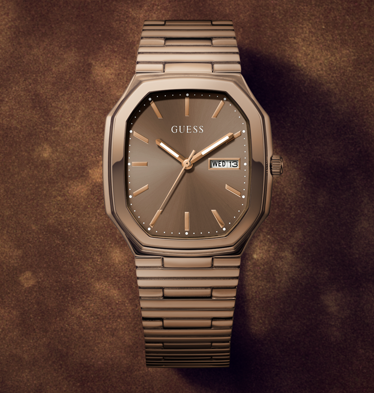 Guess watch with brown strap and face on a brown background