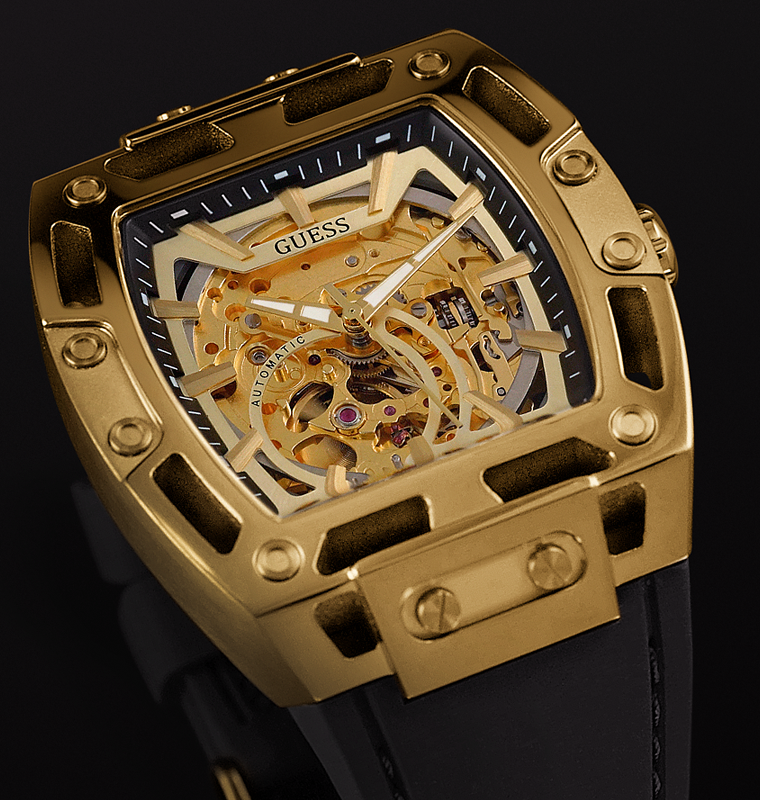 Gold skeleton watch with black strap on a dark background