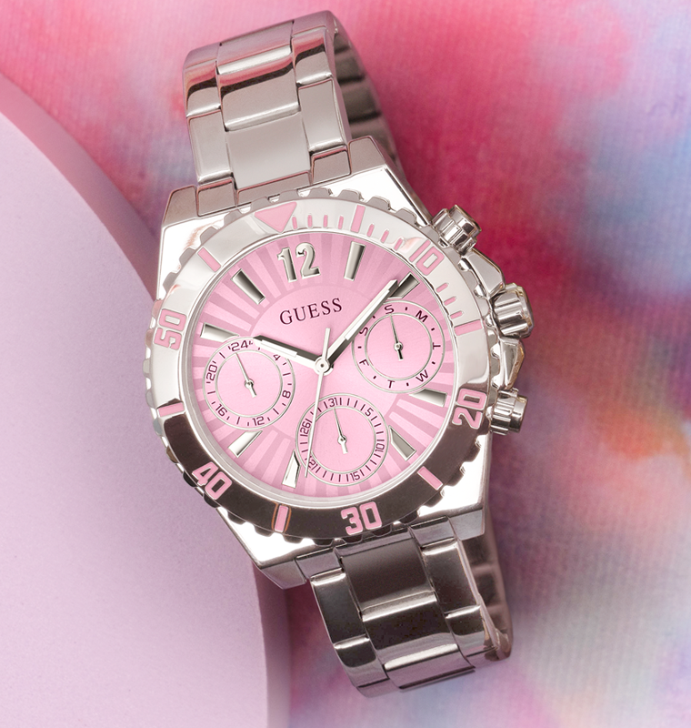 silver womens watch with pink dial on pink background