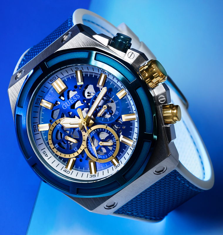 mens blue sport watch with blue stitched strap on blue background