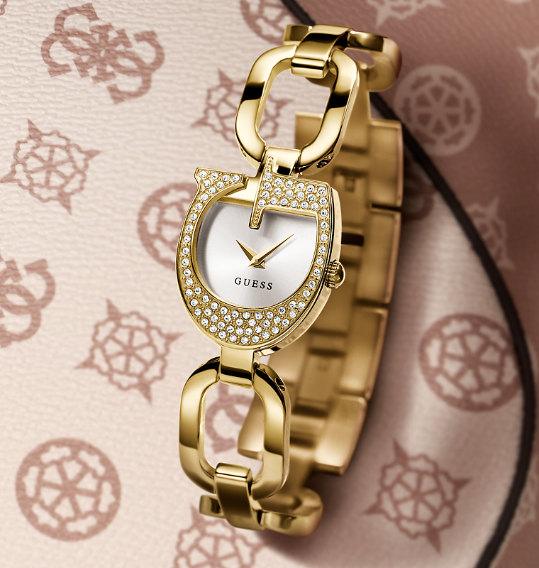 gold logo womans watch on logo patterned background