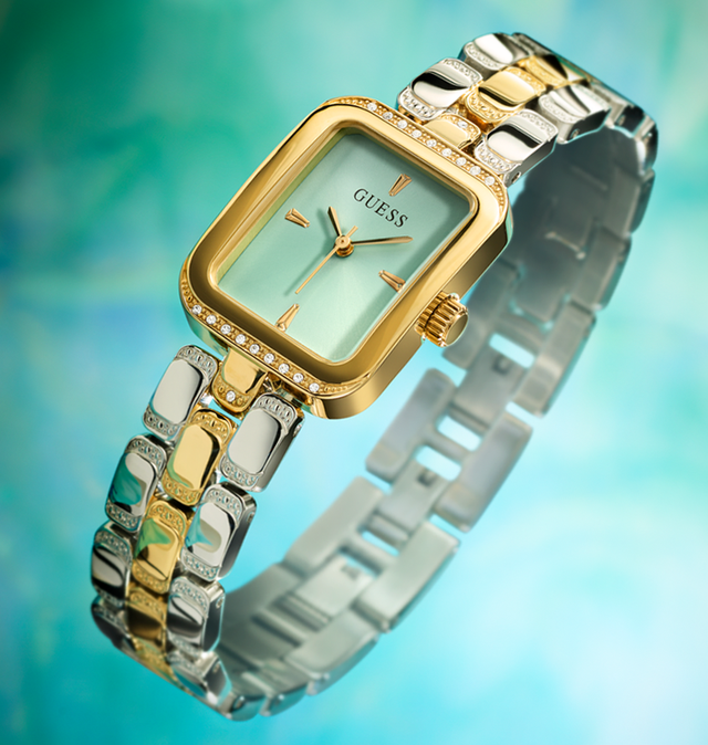 womens two tone watch with scalloped links and square shaped case with acqua dial on ethereal background