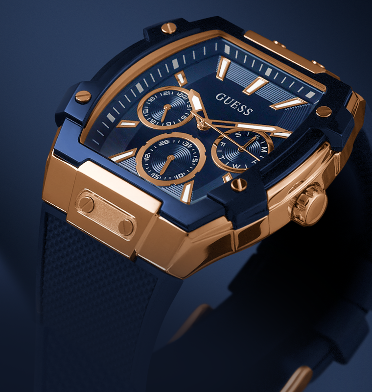 Gold and blue Guess watch on a dark background gw0945l4