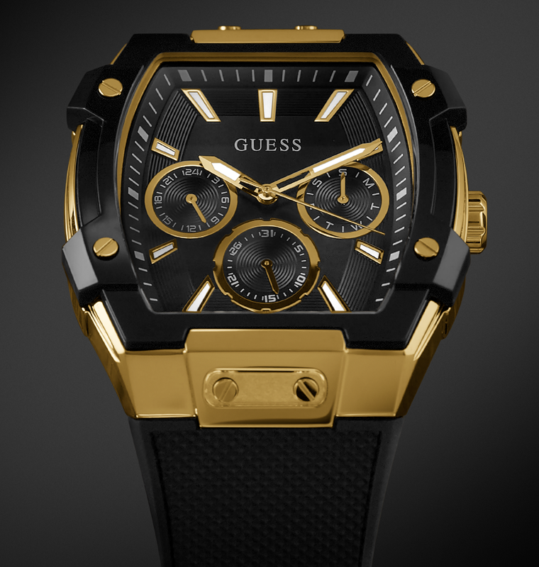 Gold and black watch with 'Guess' branding on a dark background GUESS Mens Black Gold Tone Multi-function Watch GW0956G2