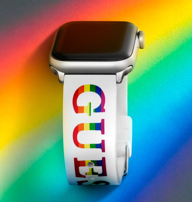 apple watch band with GUESS logo in rainbow stripes on a rainbow background