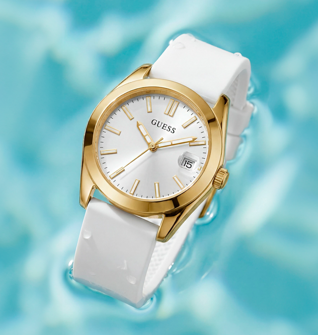 Gold and white watch with a blurred blue background