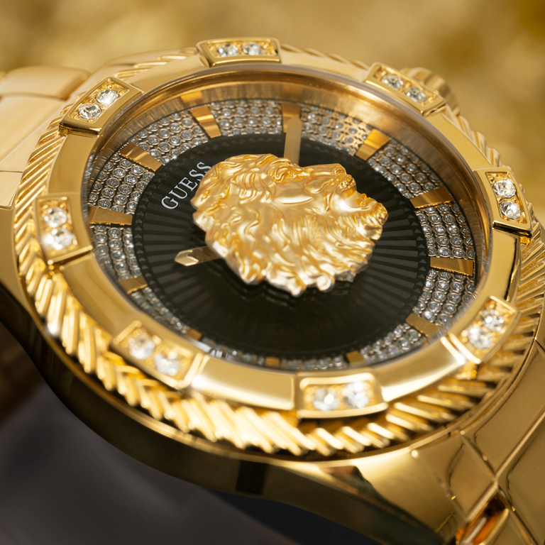 close up  of mens gold watch with lions head logo