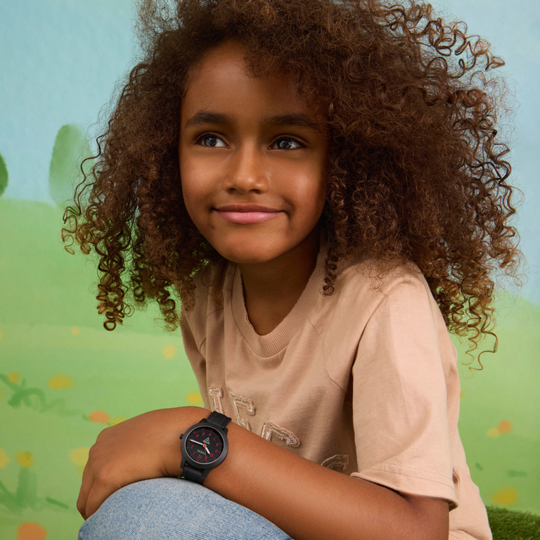 young boy wearing kids guess watch