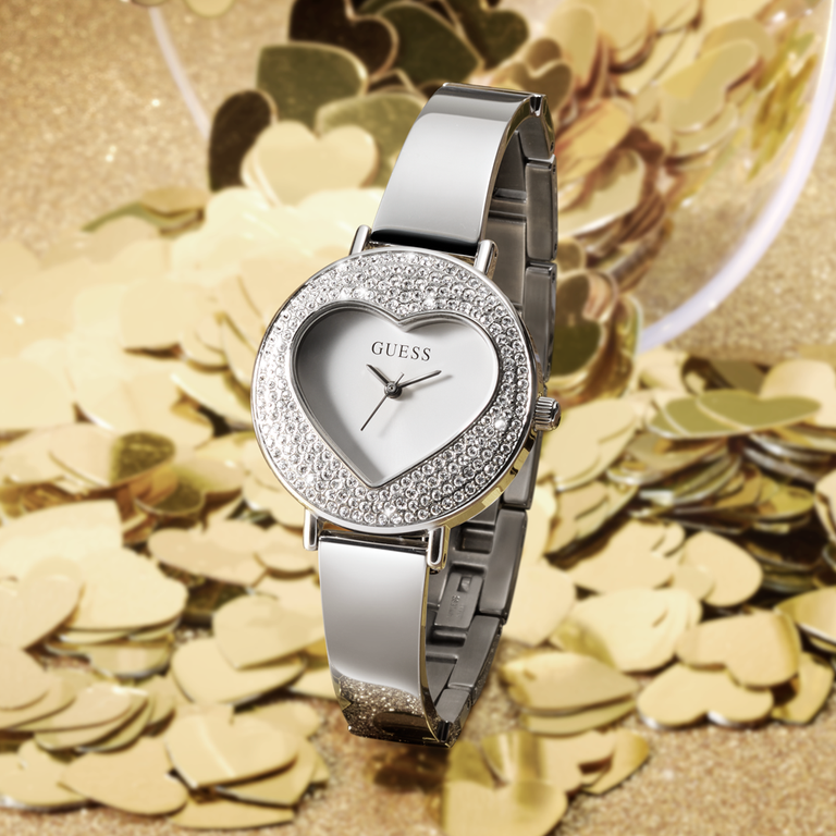 Womens GUESS watch with a heart shaped case and glitz on the dial