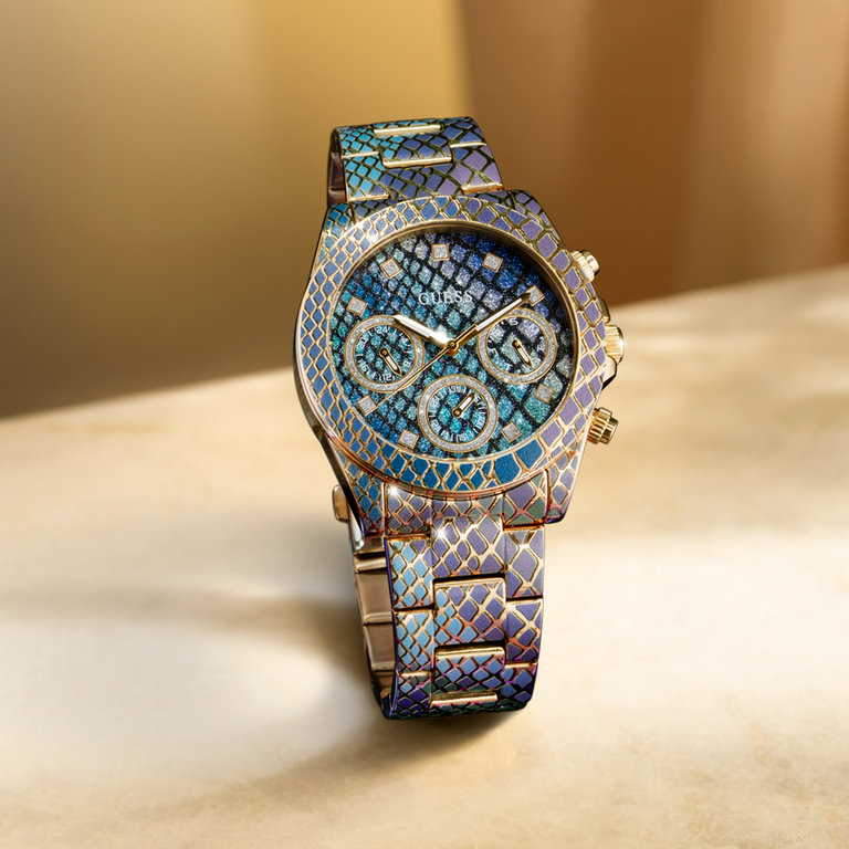 GUESS watch with python printed design on a beige surface