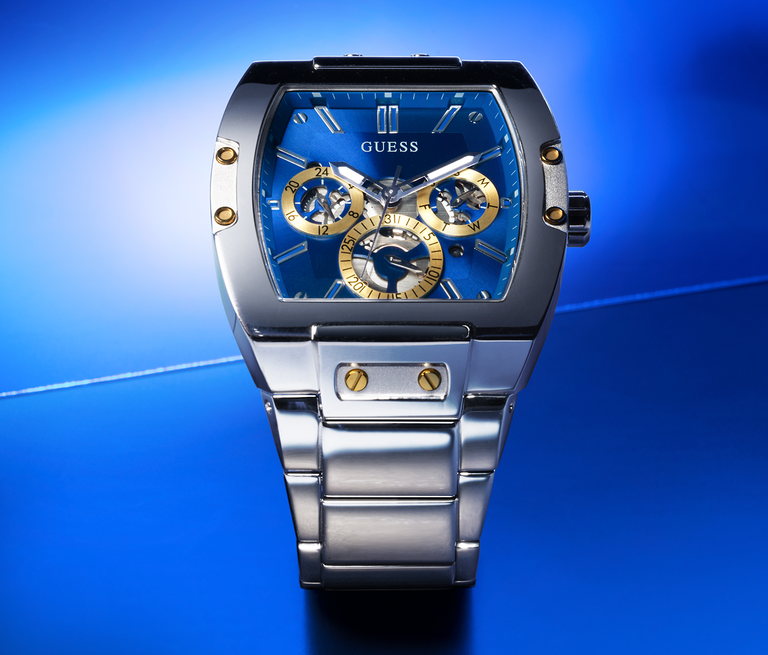 mens silver watch with blue dial on blue background