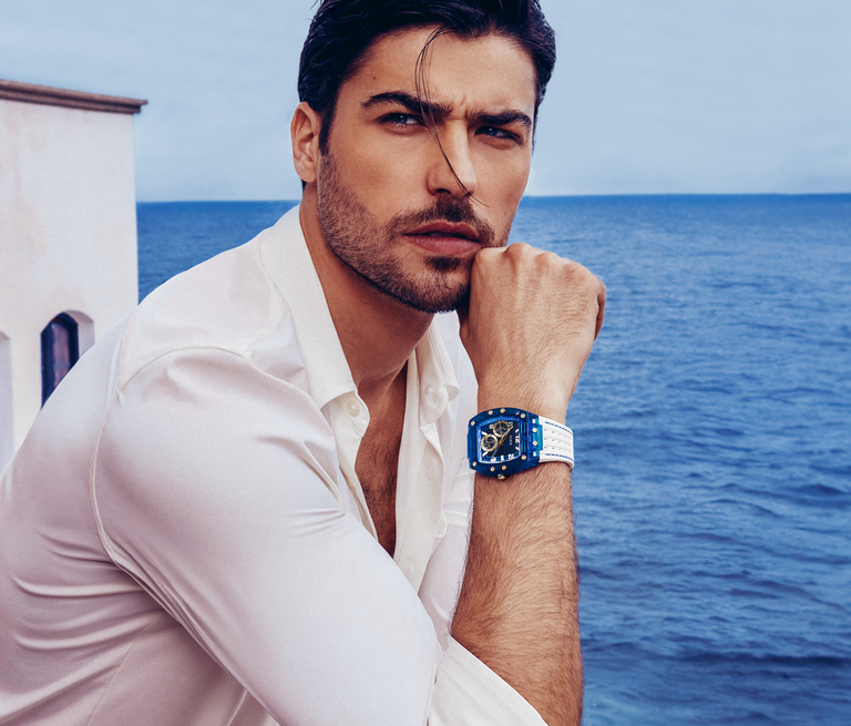 man in white shirt wearing blue and white watch