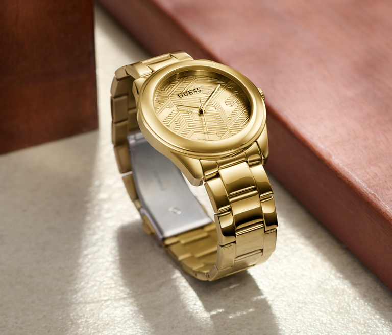 womens gold watch with logo detail on dial