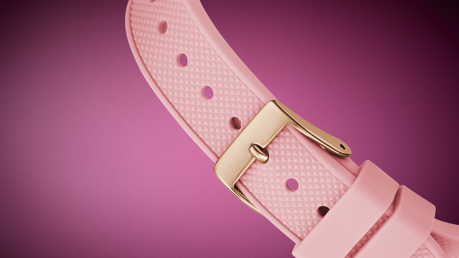 Pink watch strap with gold buckle on a pink background