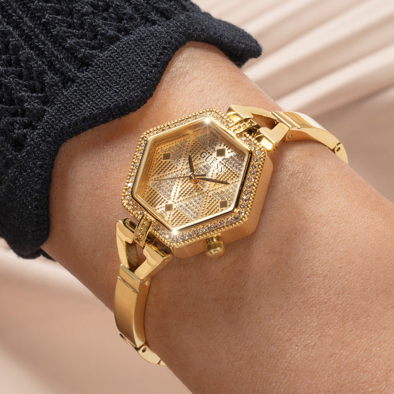 women hexagon shaped gold watch on wrist