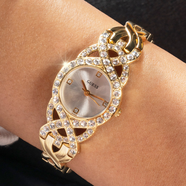 womens gold stoned watch on wrist