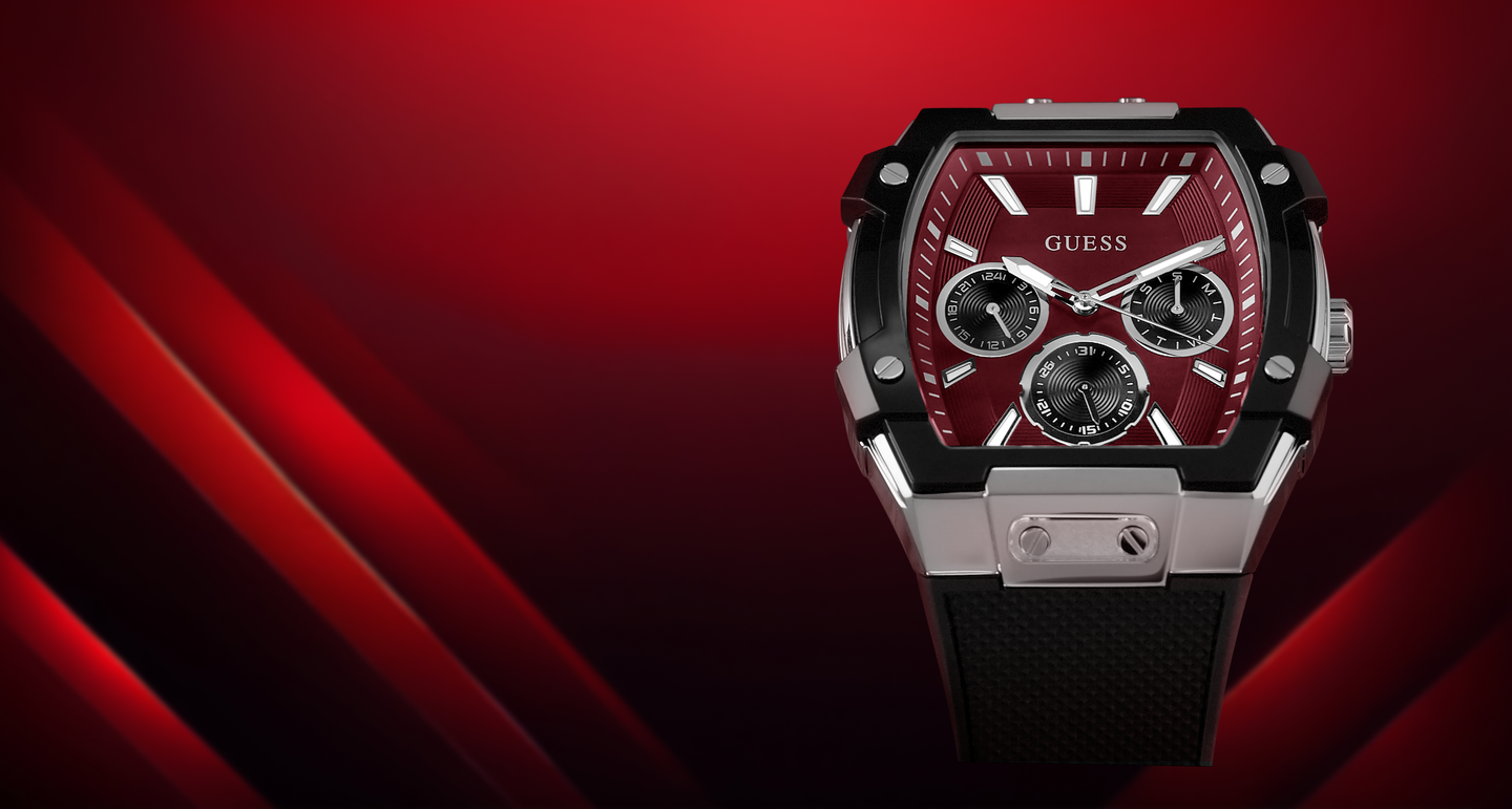 GUESS mens watch with a red dial and black strap on a red background