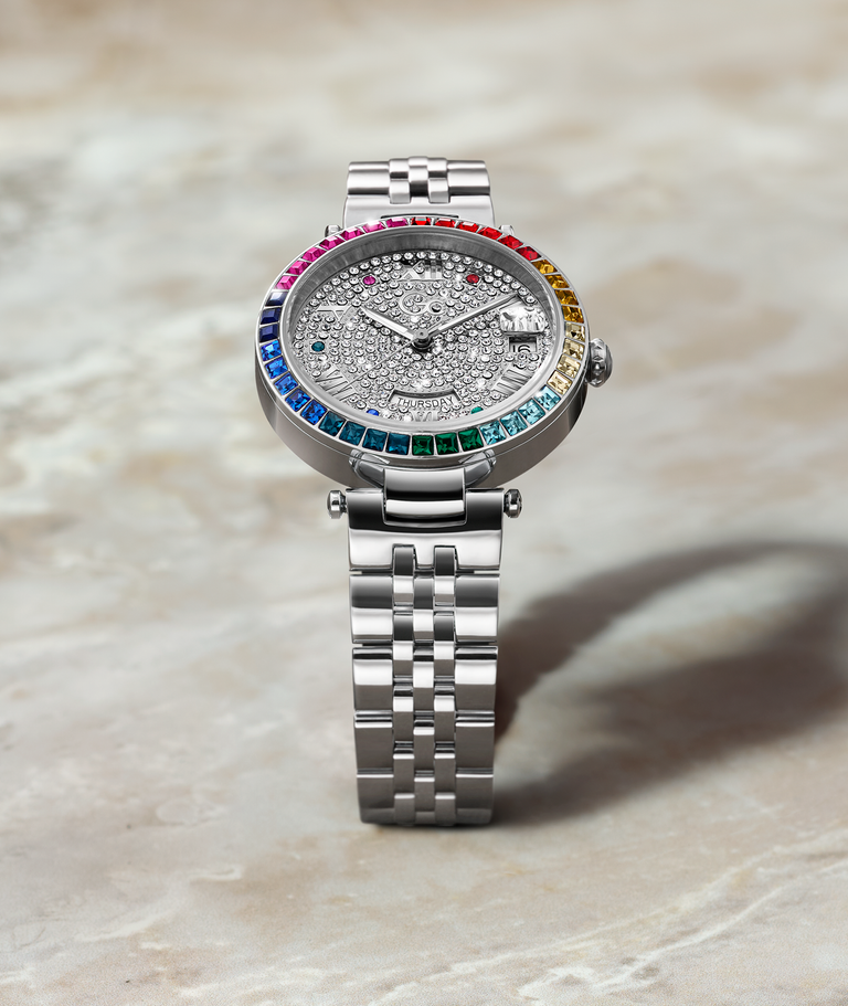 silver womens watch with diamond dial and colored gems on bezel