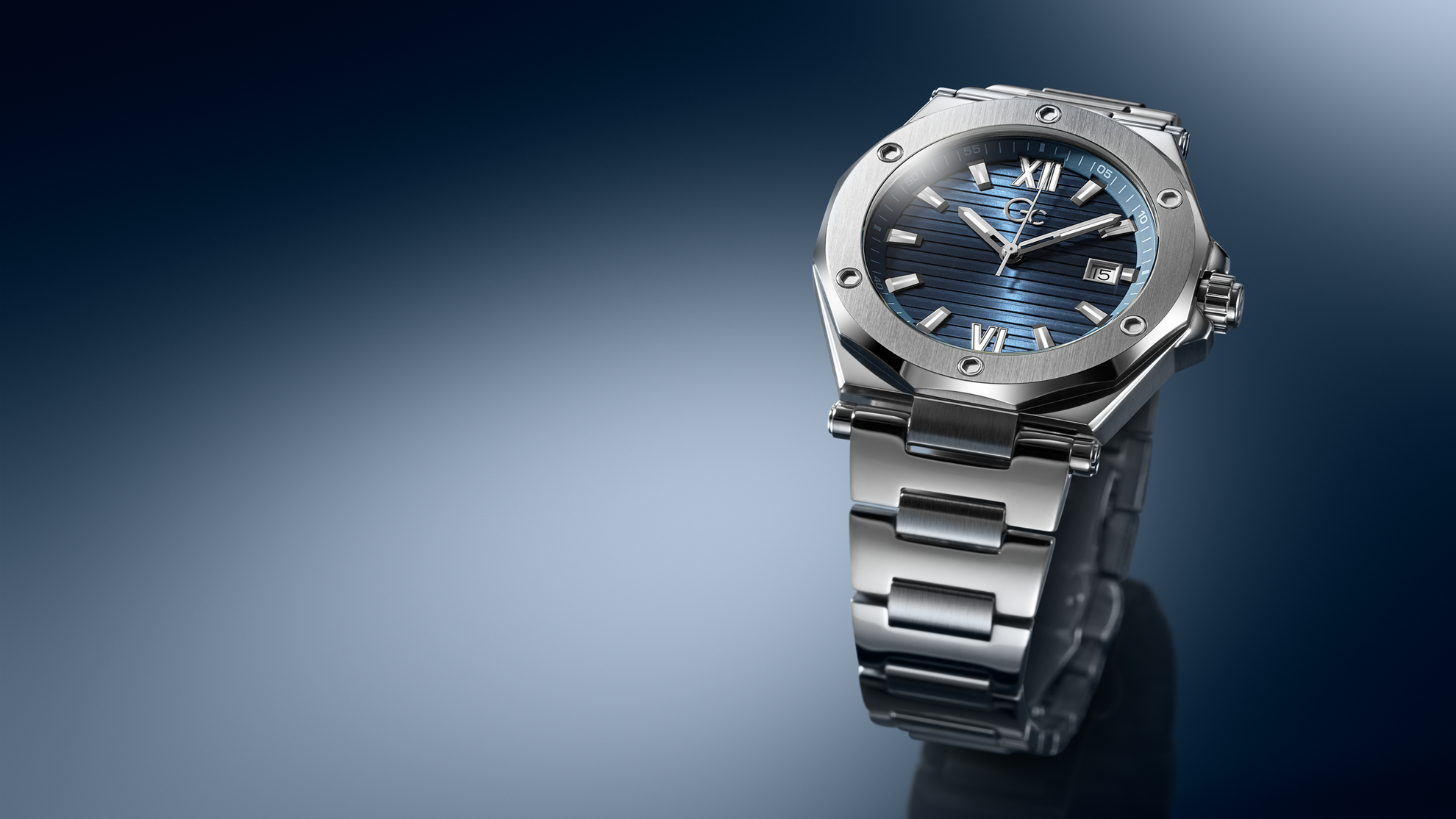 Silver watch with blue face on a dark gradient background Z67001G7