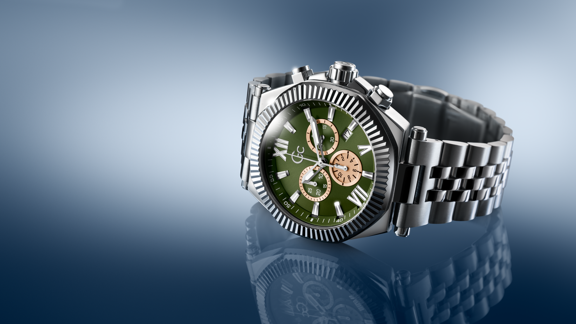 Wristwatch Z66004G9 with green dial and silver metal strap on a reflective surface