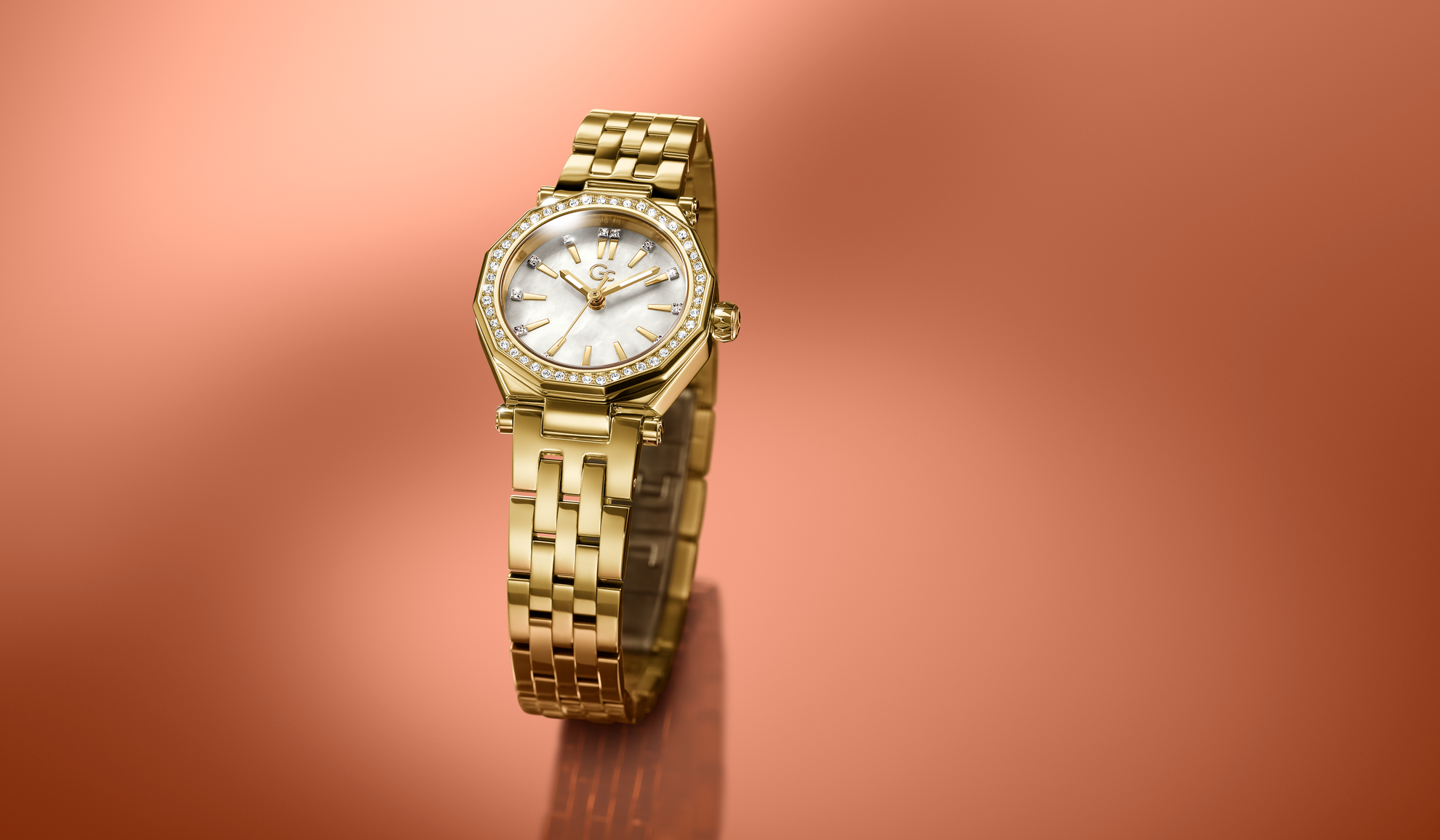 Gold wristwatch Z54005L9 with a white face on a pinkish-brown gradient background