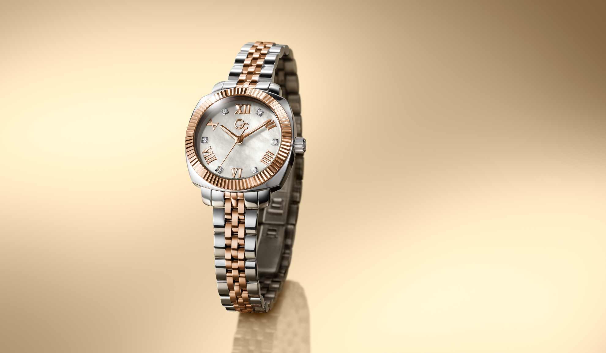 Two-tone watch Z73002L1 with a gold and silver band on a beige background