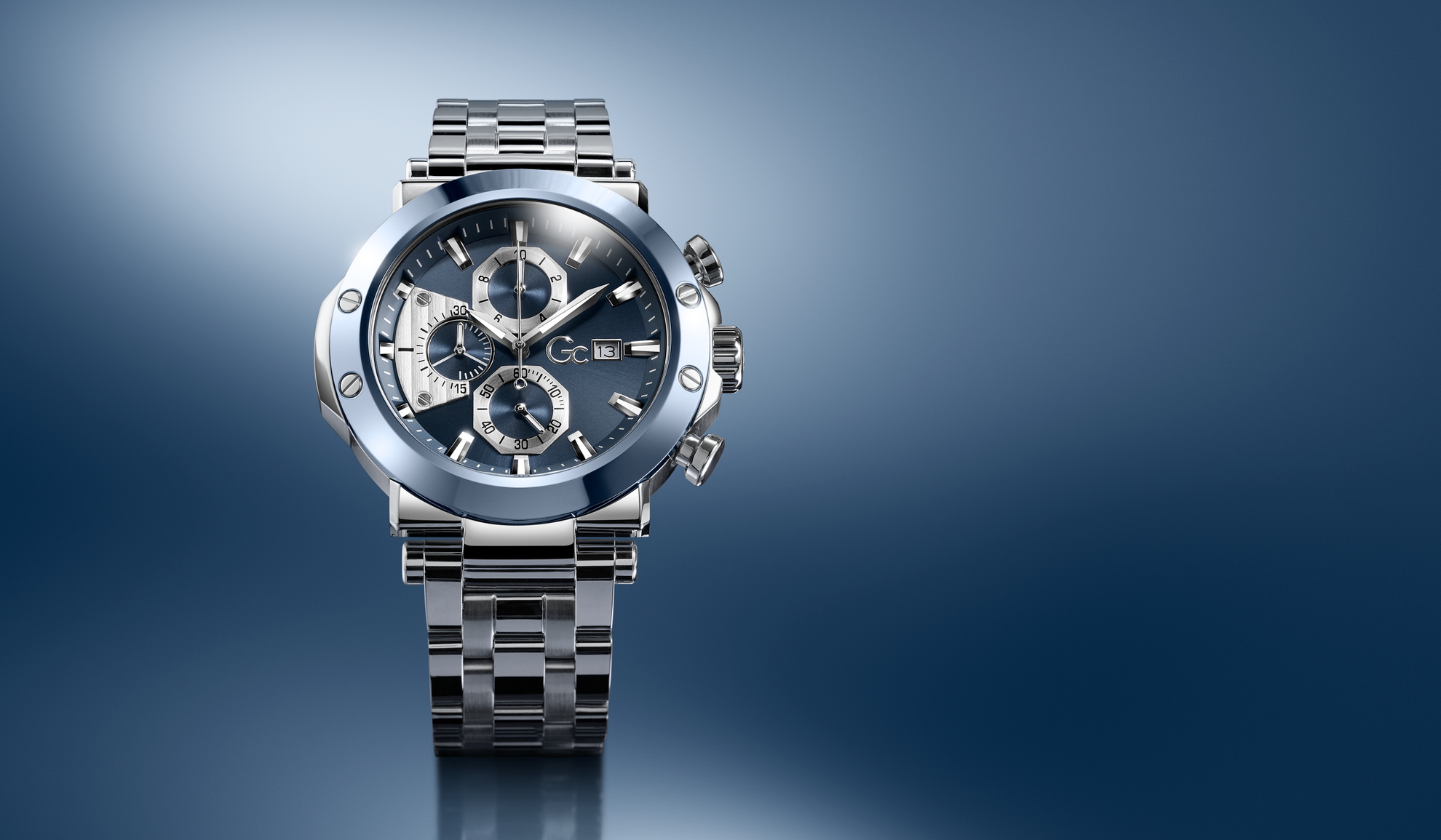 Gc TechnoForce Chrono Metal wristwatch with a detailed face on a gradient blue background