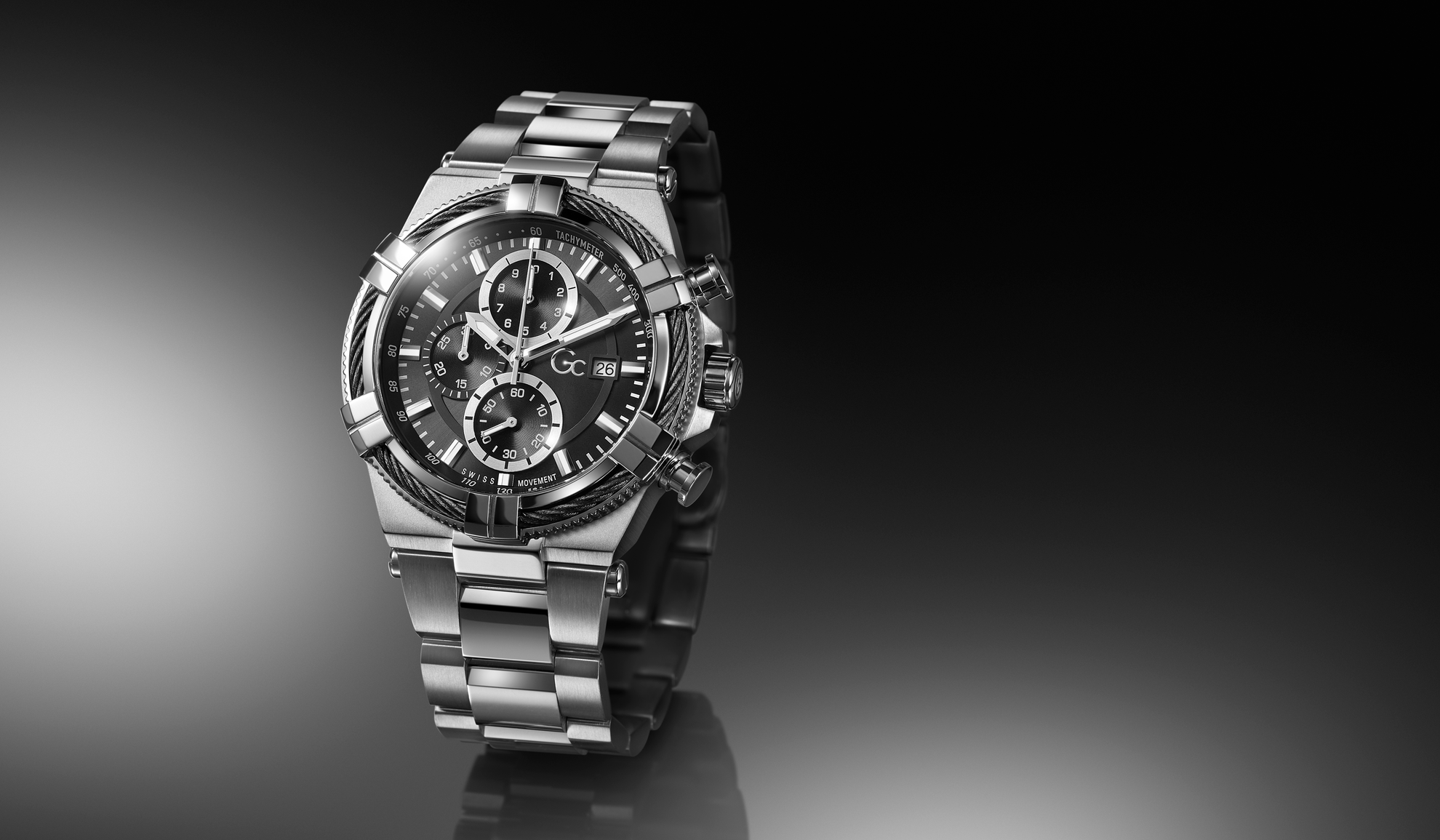 Silver wristwatch Z76001G2 with a dark face on a reflective black surface
