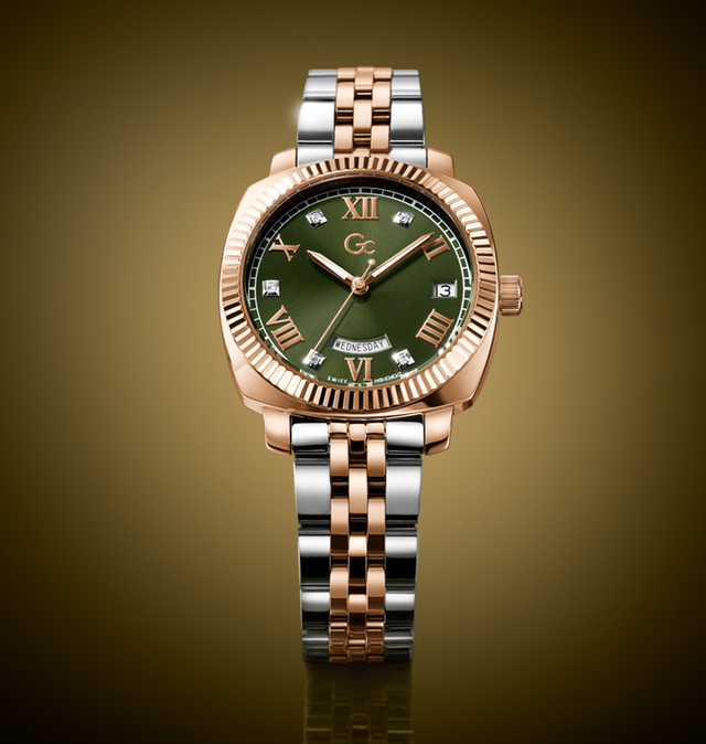 Gc Flair Coussin Lady Mid Size Metal watch with green dial and rose gold and silver bracelet on a gold background