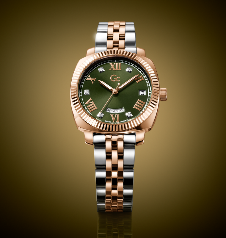 Gc Flair Coussin Lady Mid Size Metal watch with green dial and rose gold and silver bracelet on a gold background