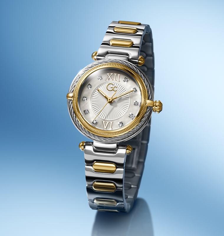 Silver and gold Gc Vogue Cable Mini Small Size Metal watch with a blue gradient background