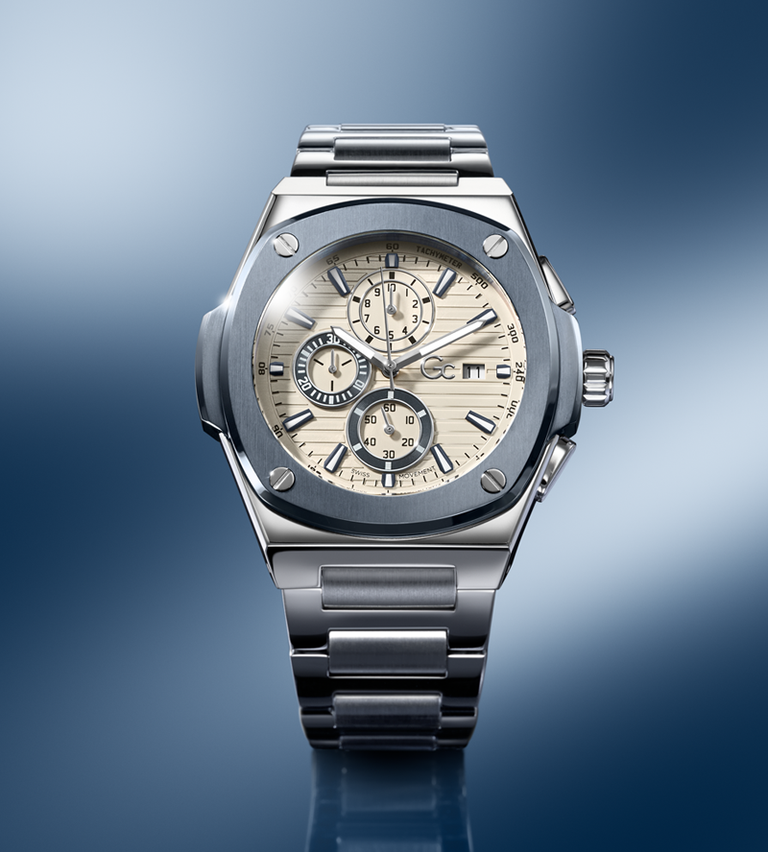 Silver Gc wristwatch with a detailed face on a gradient blue background