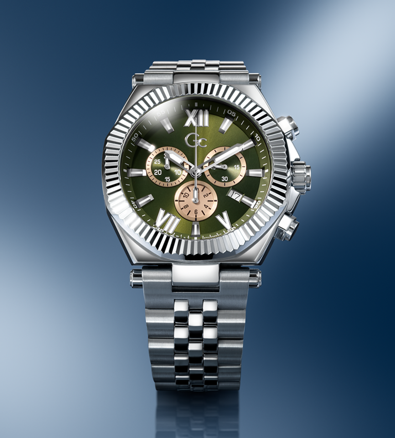 Silver Gc watch with a green face on a blue gradient background