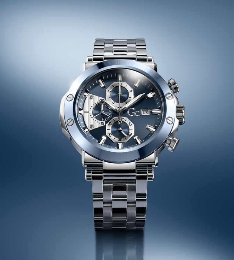 Silver Gc wristwatch with a detailed face on a gradient blue background