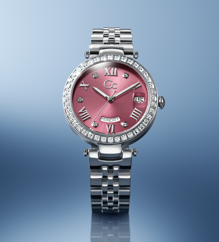 Silver Gc watch with a pink face on a blue gradient background