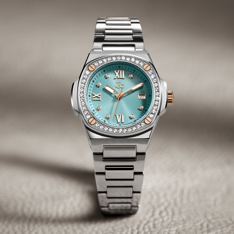 silver womans watch with turquoise dial