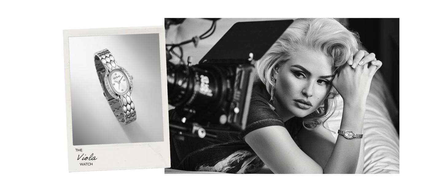 A black and white promotional image featuring a woman in a film studio setting wearing a wristwatch, alongside a smaller inset product photo of the watch on a plain background. The watch has a metal bracelet and a round dial.