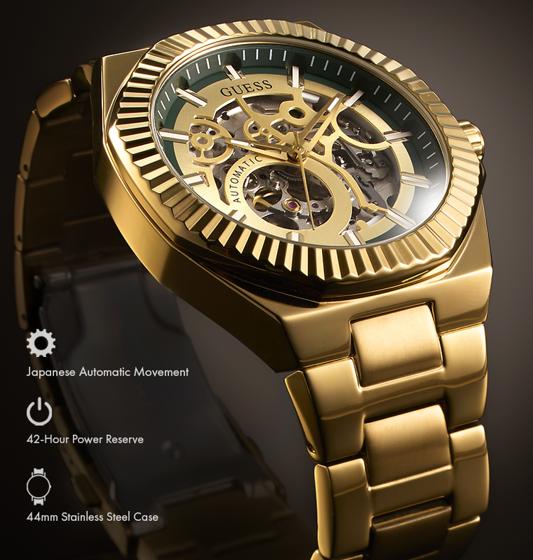 Gold-tone stainless steel skeleton watch with a fluted bezel, gold-tone metal bracelet, and dark green dial details. The image includes feature callouts for Japanese automatic movement, 42-hour power reserve, and 44mm stainless steel case.