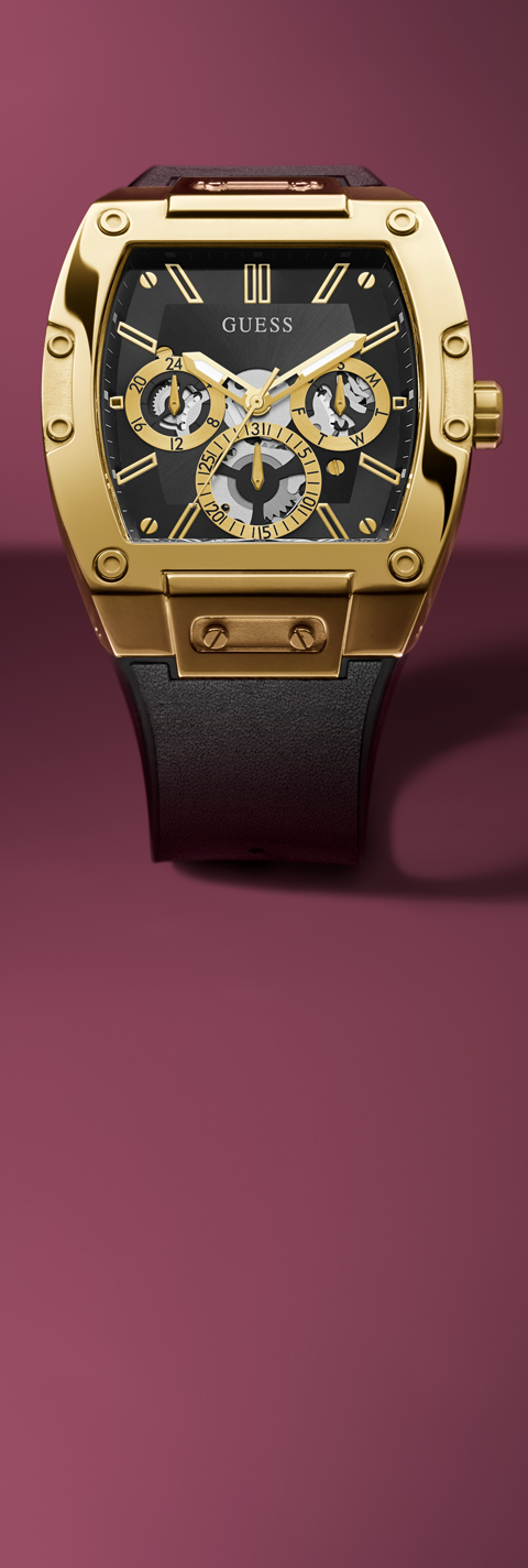 Gold and black watch with Guess logo on a red background