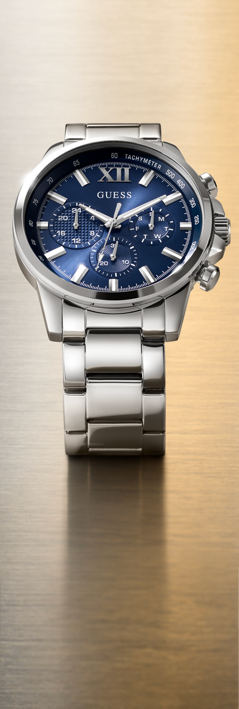 Silver watch with blue face on a gold background